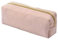 Pink textured pouch with a gold zipper on a light surface